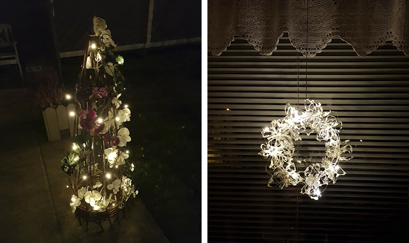 Handmade Christmas decorations. In the left a standing decoration made of willow branches, orchids and lights. In the right a window decoration made of white paper straw and lights. 