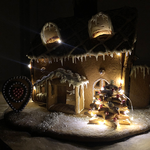 Gingerbread house with lights.