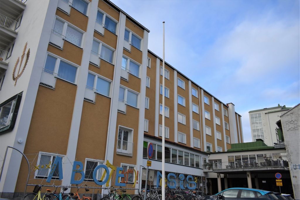 There is a six-storey apartment block which is for student housing and a terrace of a student restaurant Assarin ullakko on its second floor.