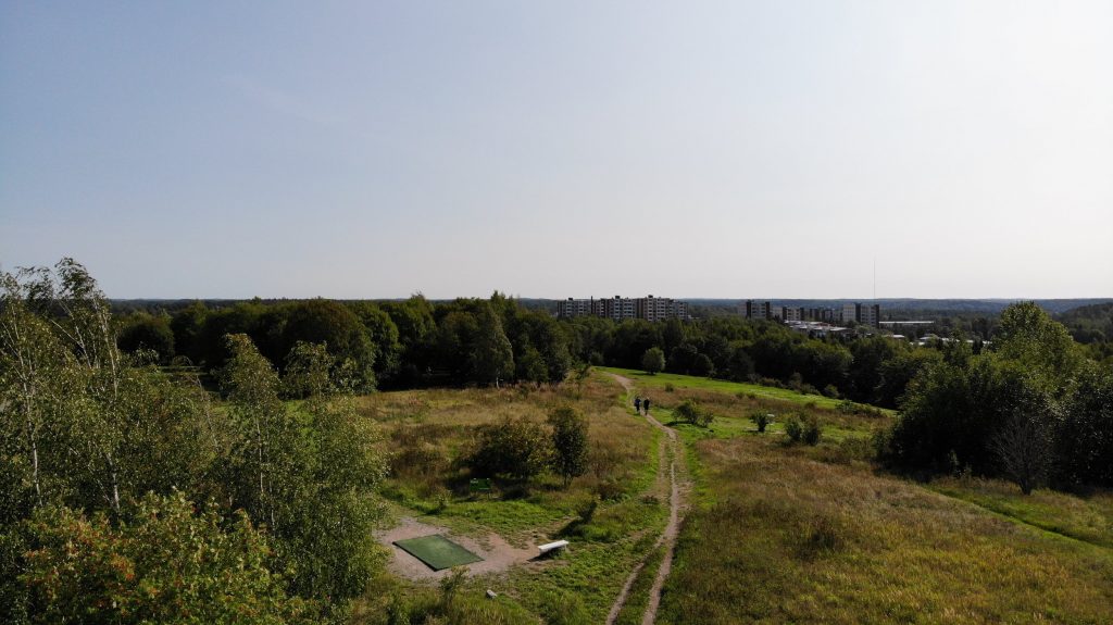 Paths, forest and few apartment blocks on top of Luolavuori in Turku.