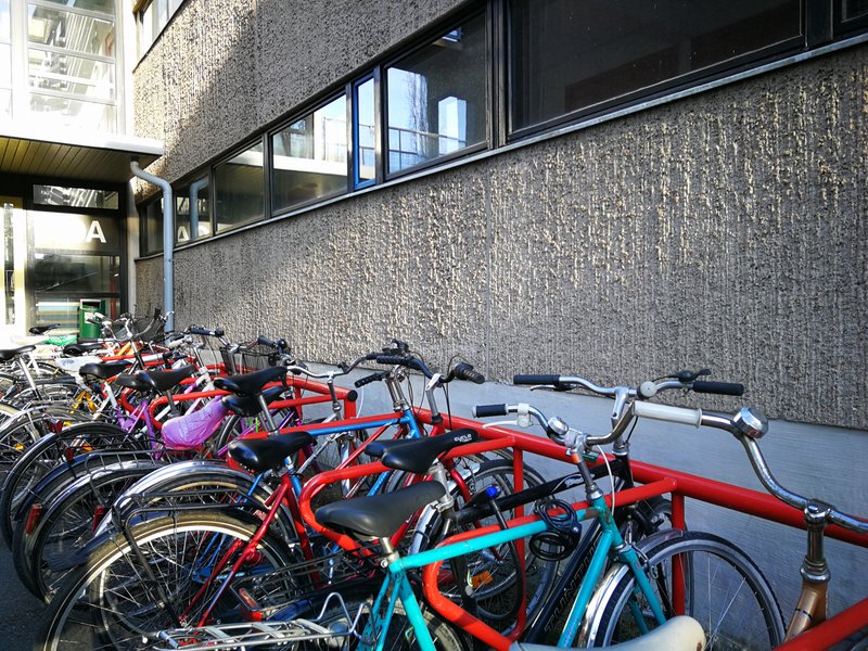 Bicycles in front of a building in Student Village in Turku