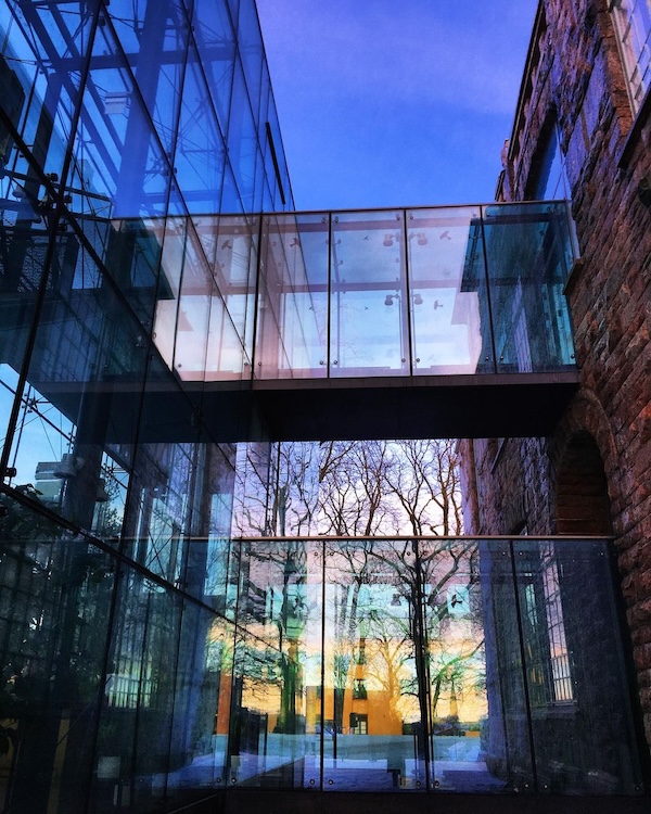 Reflections on the glass wall of the Turku Art Museum. 